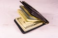 Black leather money clip with the one hundred dollar bills on wooden table Royalty Free Stock Photo