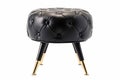 Black Leather Pouf with Gold Metallic Accents Elegant Furniture Piece. Generative AI