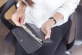 Black leather purse with hundred dollar banknote in young woman Royalty Free Stock Photo