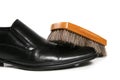 Black leather shoe and brush