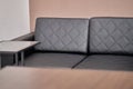 A black leather sofa in a men& x27;s stylish lawyers & x27; office. Royalty Free Stock Photo