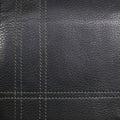Black leather stitched thread vertically and Royalty Free Stock Photo