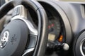 Black leather streering wheel and control panel in the car. Royalty Free Stock Photo