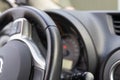 Black leather streering wheel and control panel in the car. Royalty Free Stock Photo