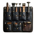A leather tool roll organizer with various crafting tools inside the pockets Royalty Free Stock Photo