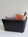 black leather wallet with australian banknotes and white background Royalty Free Stock Photo