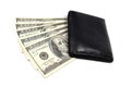 Black leather wallet on a fan of dollars isolated on a white background Royalty Free Stock Photo