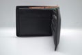 A black leather wallet for men is a place to keep credit cards and cash. Royalty Free Stock Photo