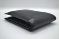 A black leather wallet for men is a place to keep credit cards and cash. Royalty Free Stock Photo