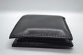 A black leather wallet for men is a place to keep credit cards and cash. Royalty Free Stock Photo