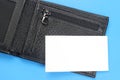 Black leather wallet opened with a blank white card mock up Royalty Free Stock Photo