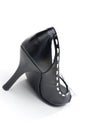 A black leather womans high heel shoe
