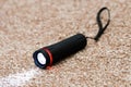 Black led flashlight with beam of light Royalty Free Stock Photo