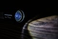black led operational flashlight on rough wooden surface - closeup with selective focus Royalty Free Stock Photo
