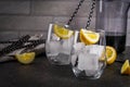 Black lemonade with ice and lemon Royalty Free Stock Photo