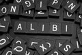 Black letter tiles spelling the word & x22;alibi& x22; Royalty Free Stock Photo