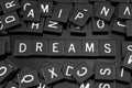 Black letter tiles spelling the word & x22;dreams& x22; Royalty Free Stock Photo