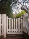 black lettering school house white picket gate fence country house close up