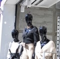 Black lifeless mannequin. There`s clothes on. Made of plastic.