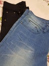 Black and light blue denim jeans pant with front look design with pocket and buttons Clothes photography