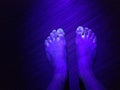 Black light on colorful feet