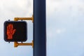 A orange pedestrian crossing signal. Royalty Free Stock Photo