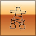 Black line Inukshuk icon isolated on gold background. Vector