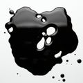 A black liquid spill with irregular edges and circular voids is on a white surface. The Royalty Free Stock Photo