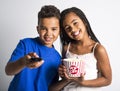 Black little boy and girl watching movie with pop corn Royalty Free Stock Photo