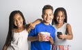 Black little boy and sister girl watching movie with pop corn Royalty Free Stock Photo