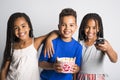 Black little boy and sister girl watching movie with pop corn Royalty Free Stock Photo