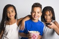 Black little boy and sister girl watching movie with pop corn Royalty Free Stock Photo