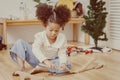 Black little girl child playing wooden toy at home alone vintage color tone Royalty Free Stock Photo