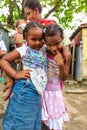 Black Little Girls Hugging and Posing for the Camera in the Refuge for People From Natural Disaster