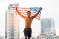 Black lives matter concept, african american guy with usa flag shouting against city background, protest against racism Royalty Free Stock Photo