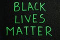 Black lives matter. Inscription green words on board