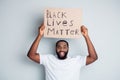 Black lives matter. Photo of cheerful dark skin african protester hold placard against black citizens lawlessness