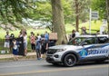 Police Car Drives By Protestors at Police Station