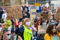 Black Lives Matter protesters wear PPE Face Masks and hold homemade signs at a BLM protest in Richmond, North Yorkshire