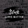 Black lives matter text as graffiti on brick wall