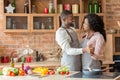 Black lovely married couple dancing in kitchen Royalty Free Stock Photo