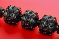 Black lumpy foam body massage roller on red background Royalty Free Stock Photo
