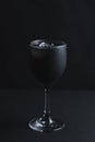 Black on Black Luxury Cocktail with Activated Charcoal and Black Vodka Royalty Free Stock Photo