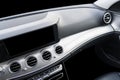 Black luxury modern car Interior. Steering wheel, shift lever and dashboard. Detail of modern car interior. Automatic gear stick. Royalty Free Stock Photo