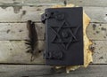 Black magic book on the planks 1