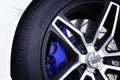 Black magnesium alloy wheels of racing car. Royalty Free Stock Photo