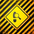 Black Magnifying glass with footsteps icon isolated on yellow background. Detective is investigating. To follow in the