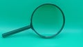 a black magnifying glass isolated on a solid teal background. Royalty Free Stock Photo