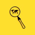 Black Magnifying glass with world map icon isolated on yellow background. Analyzing the world. Global search sign. Long
