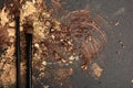 Black make up brushes and brown and gold eyeshadows Royalty Free Stock Photo